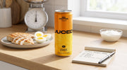 A can of JUCED fruit protein drink beside a notepad with a simple protein calculation, illustrating how much protein an adult actually needs each day