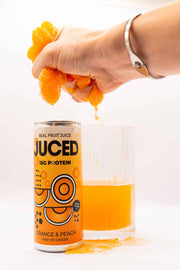 orange juice being squeezed