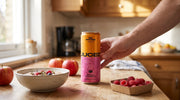 Family kitchen scene with a can of JUCED Cloudy Apple and Raspberry protein drink alongside breakfast, representing a clean protein drink for families