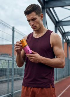 A can of JUCED fruit protein drink next to a discarded protein shaker, showing a lighter alternative for people who hate protein shakes