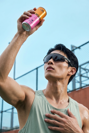 Man holding a refreshing can of JUCED collagen protein