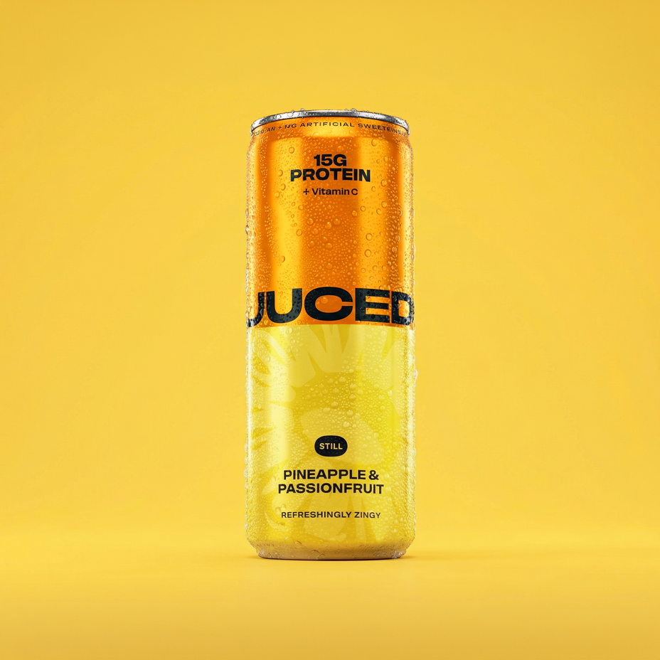 JUCED Pineapple & Passionfruit can on a yellow background